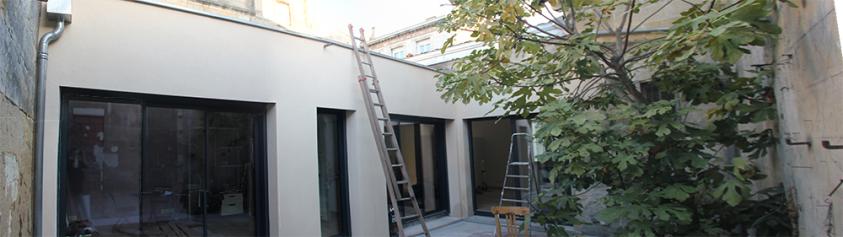 Façade sur cour intérieure, vue sur l'extension.